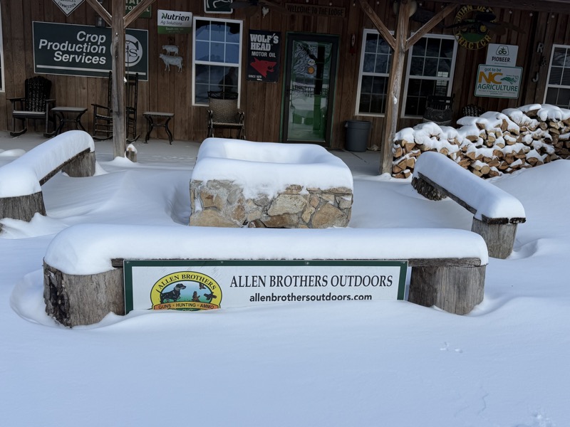 Fire pit at the front of the lodge in the snow (Feb 2026)