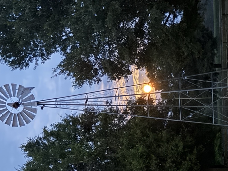 Sunset glow behind the windmill
